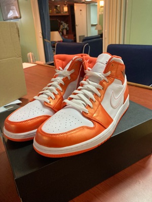 jordan 1 mid metallic orange on feet