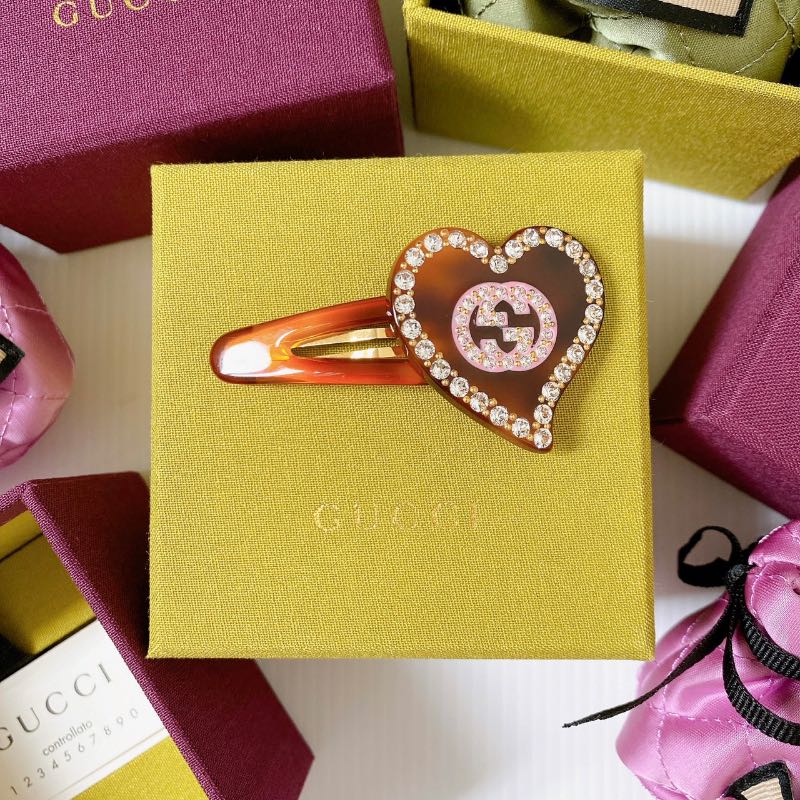 Shop GUCCI 2024 SS Hair clip with gg and heart detail (679036