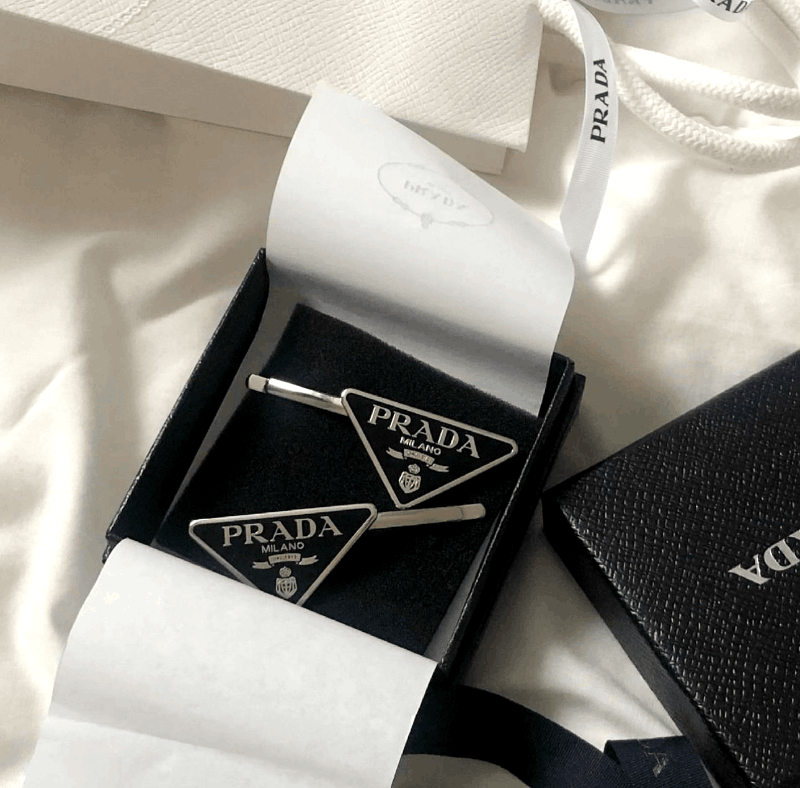 Prada slot best sale metal symbol