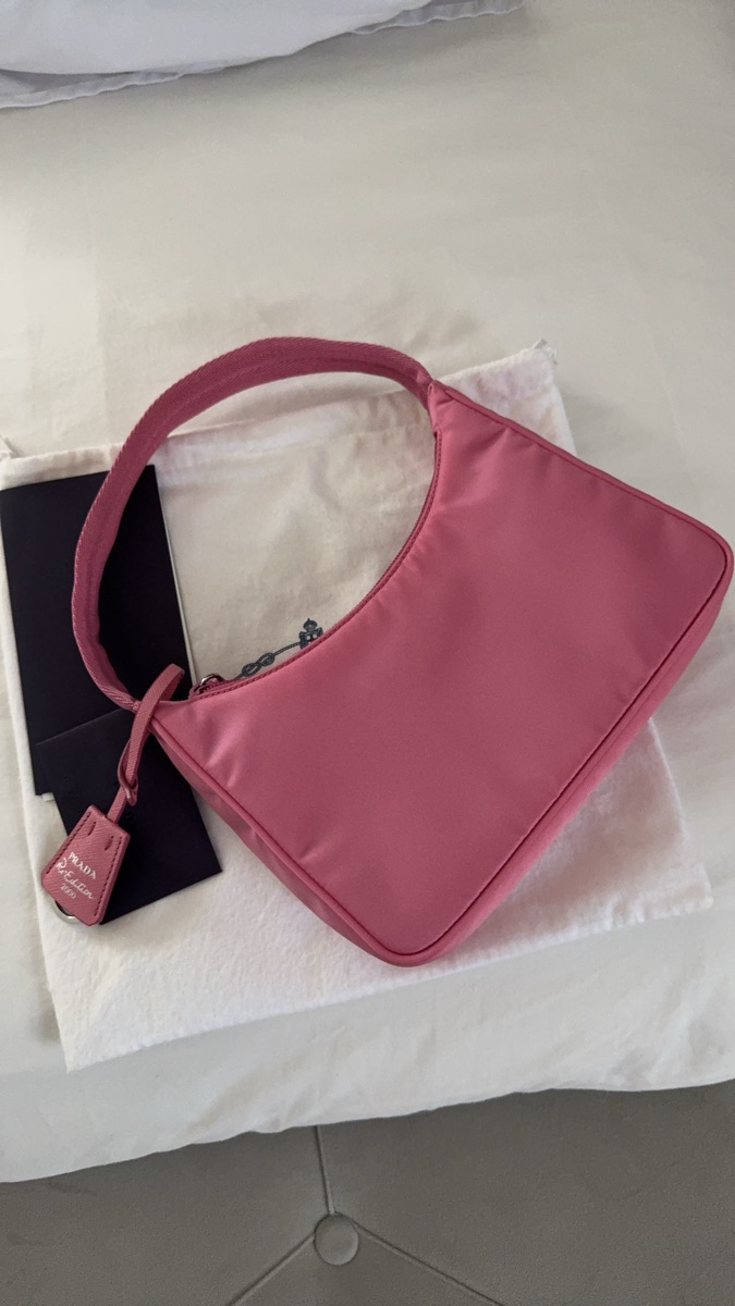 Prada Re-Edition 2000 Nylon Mini Bag With Enameled Metal Triangle