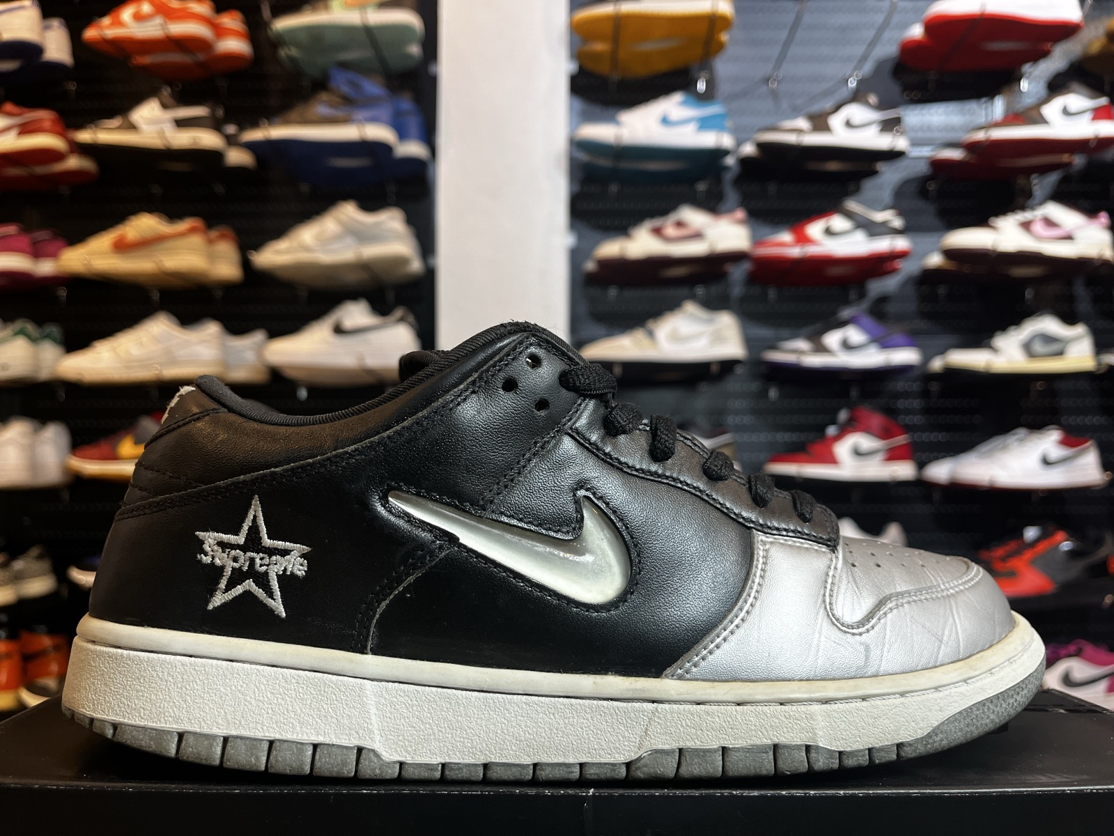 nike sb dunk low supreme jewel swoosh silver on feet