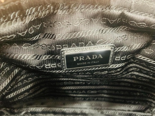 Shop PRADA RE NYLON Re-Nylon and Saffiano leather shoulder bag  (2VH160_2DMH_F0002_V_OOO) by Pohutukawa